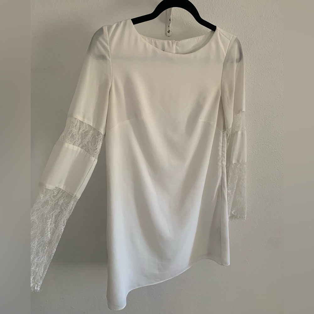Bebe white mini dress with lace bell sleeves